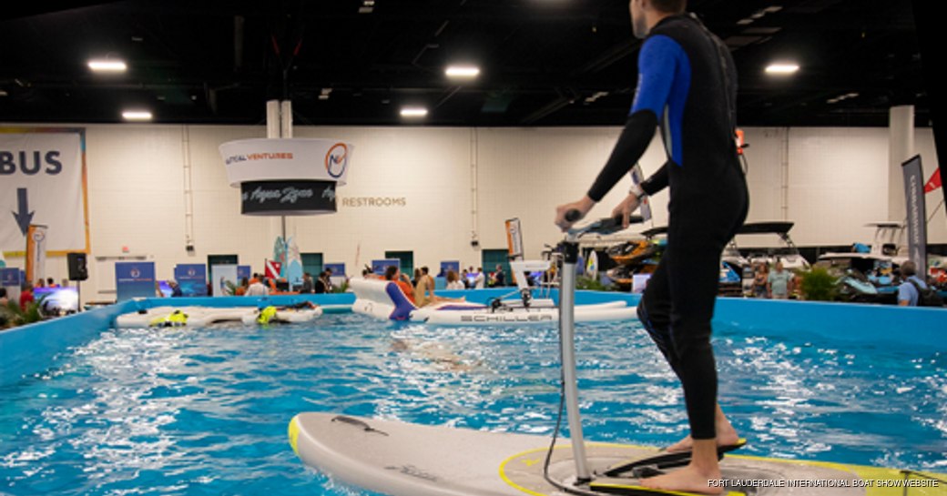 Man doing a paddleboarding demonstration at the Fort Lauderdale International Boat Show 