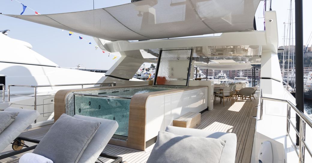 Deck Jacuzzi and exterior seating onboard charter yacht ANDIAMO