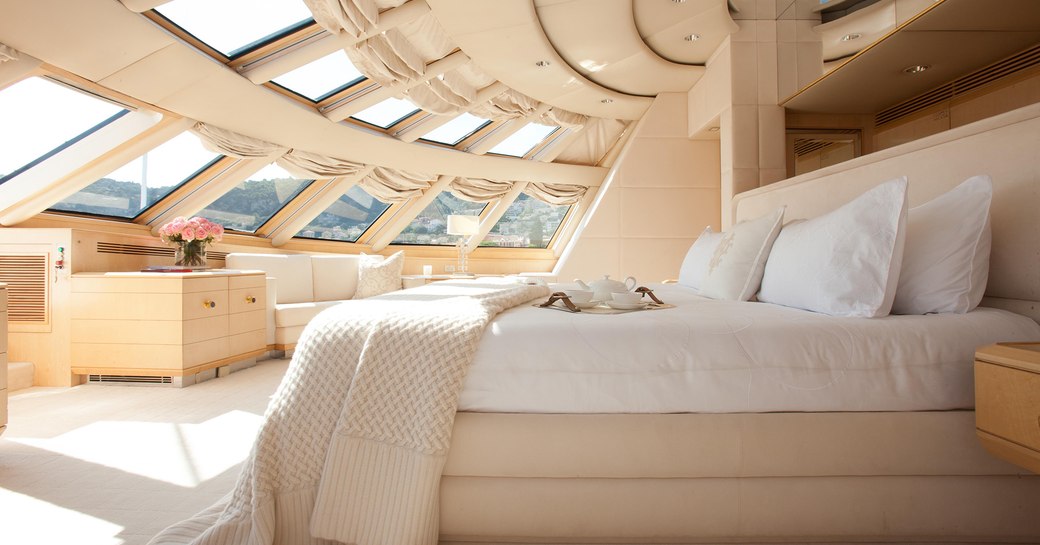 Main salon on superyacht AZZURRA II, with tall windows to allow plenty of light in 