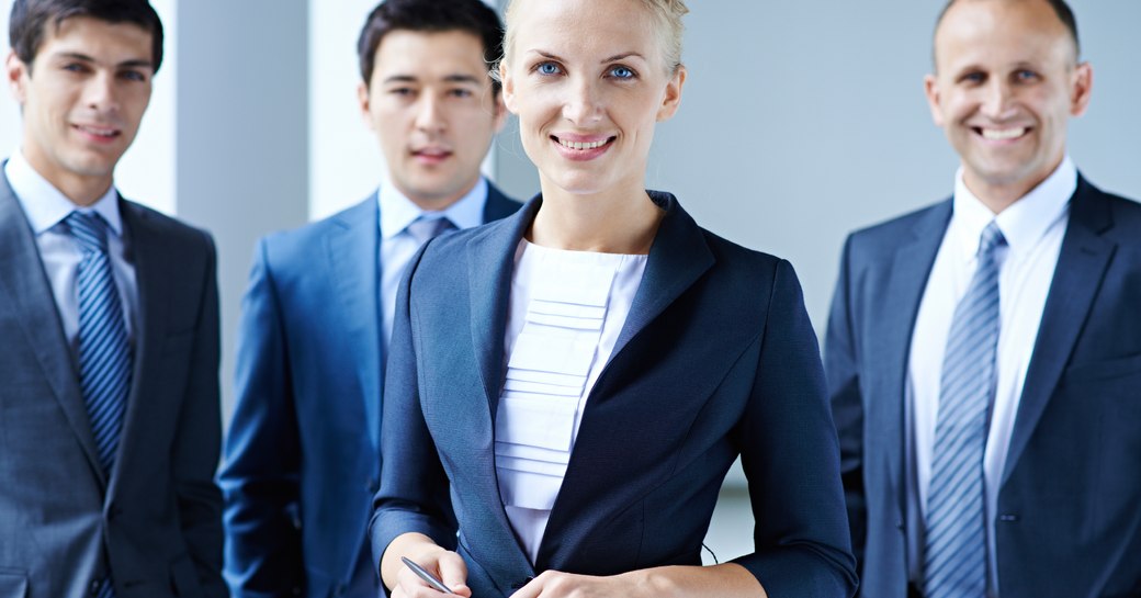 Smiling group of professionals in suits