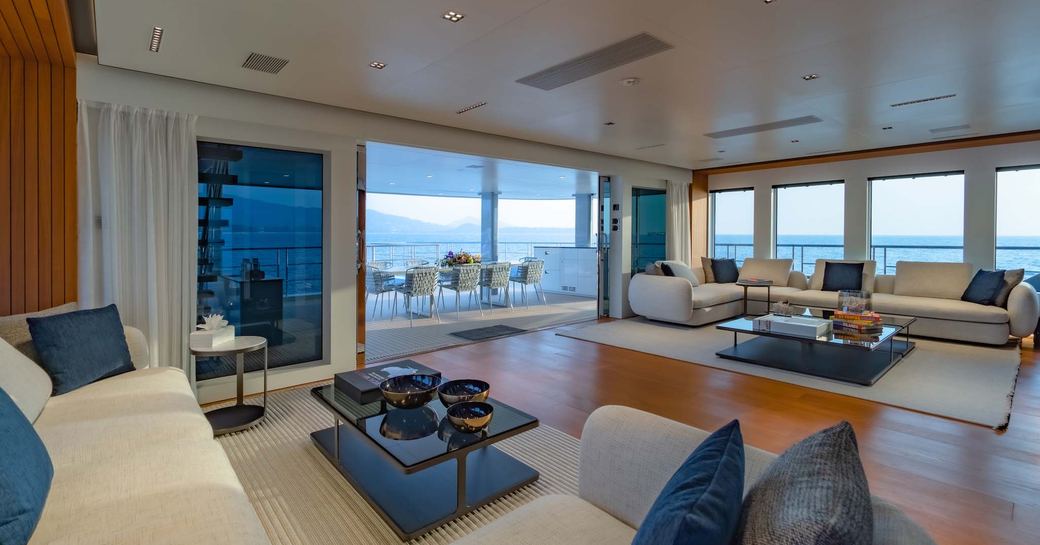 Main salon with seating and large windows onboard charter yacht SPACE CAT