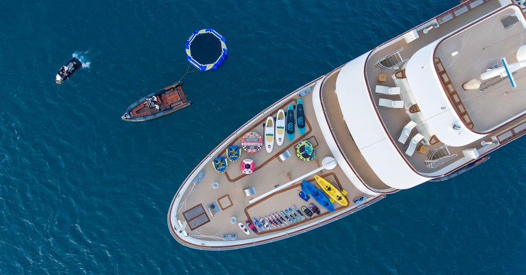 aerial view of foredeck of luxury yacht SHERAKHAN with water toys laid out deck