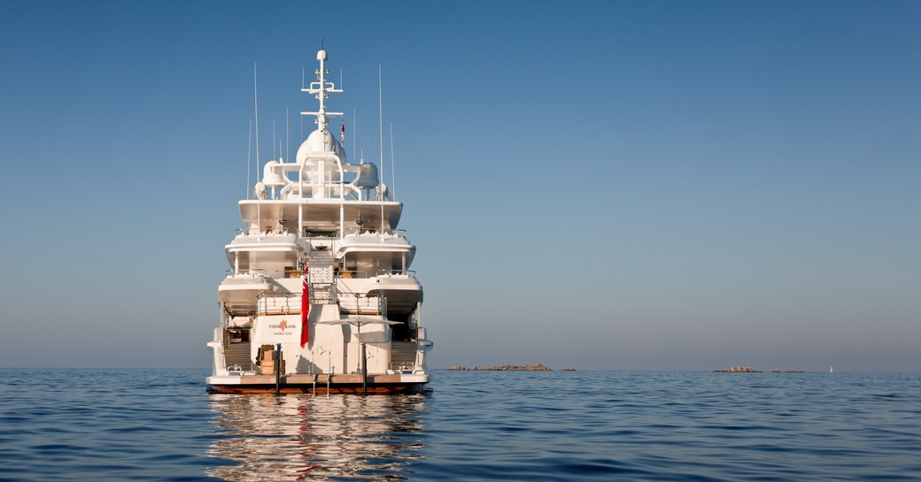 An aft view of superyacht 'Coral Ocean' sat on the water