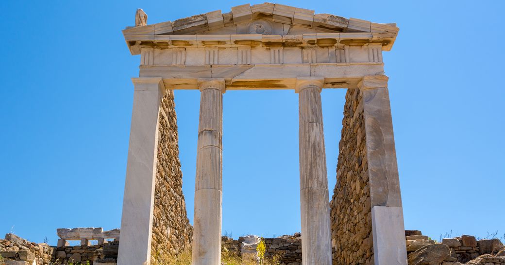 Greek ruins against blue sky