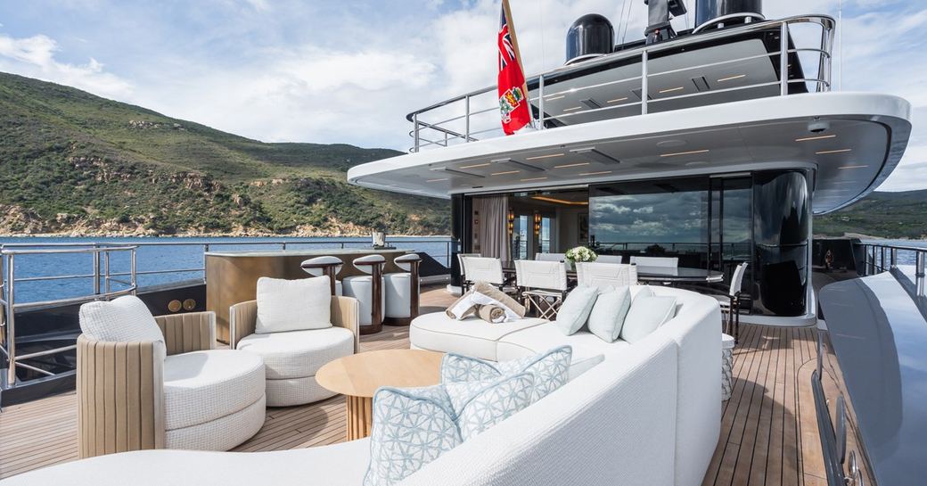 Exteriors onboard charter yacht M with plush white seating