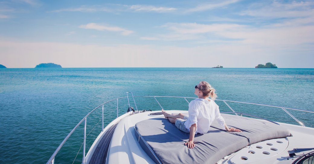 woman on foredeck of yacht