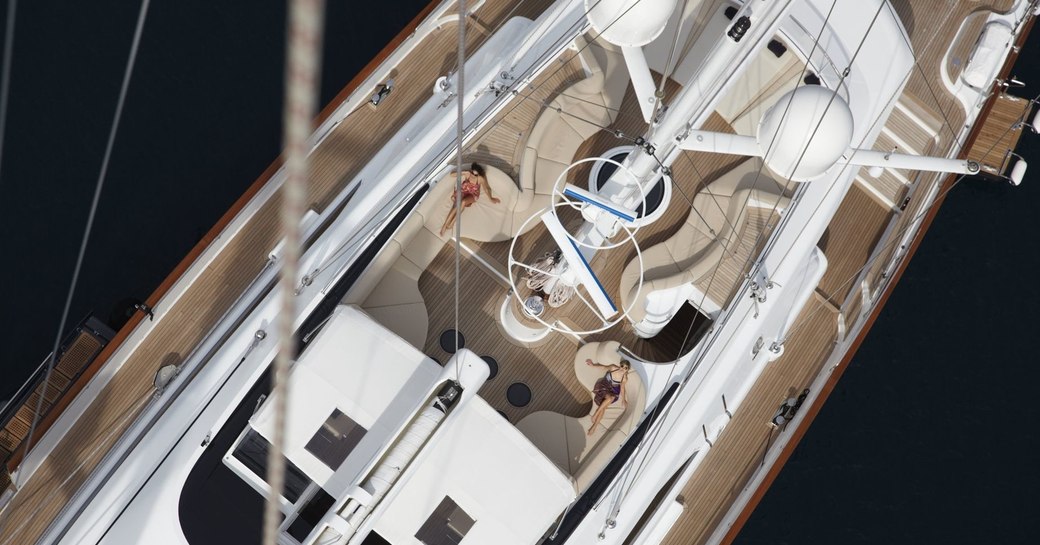 guests lounge on the seating on the sundeck of motor yacht PANTHALASSA 