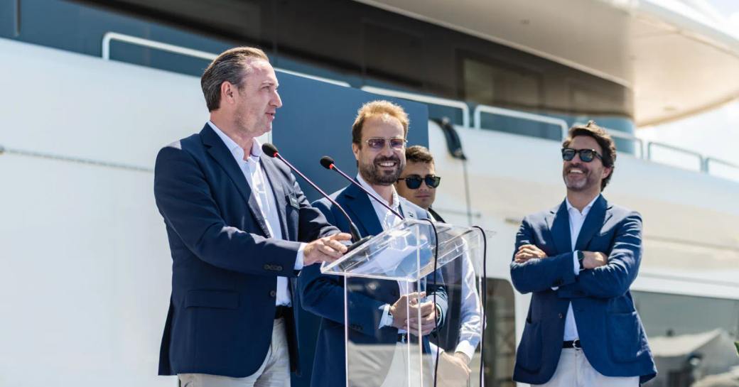 Relaunch of charter yacht ALFA with Benetti representatives at podium