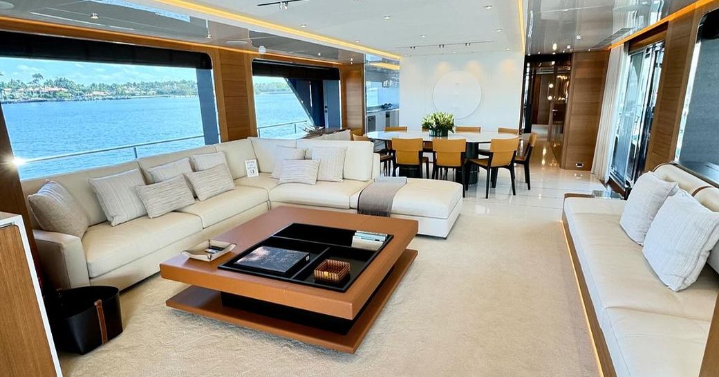 Main salon overview with lounge forward an aft dining area onboard charter yacht A SALT WEAPON