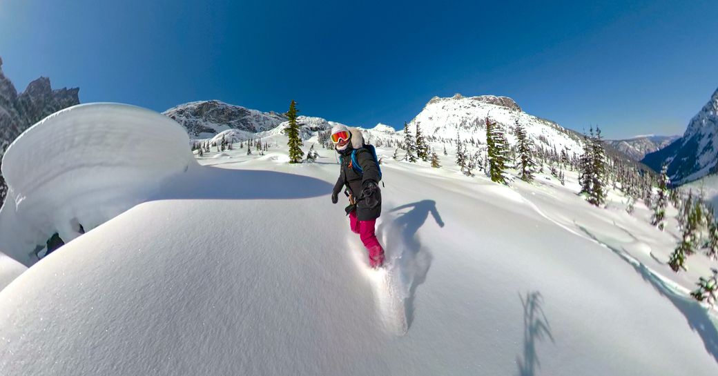 A charter guest snowboarding in Bella Coola