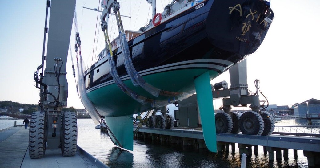 Sailing yacht Axia in travel lift preparing to be launched