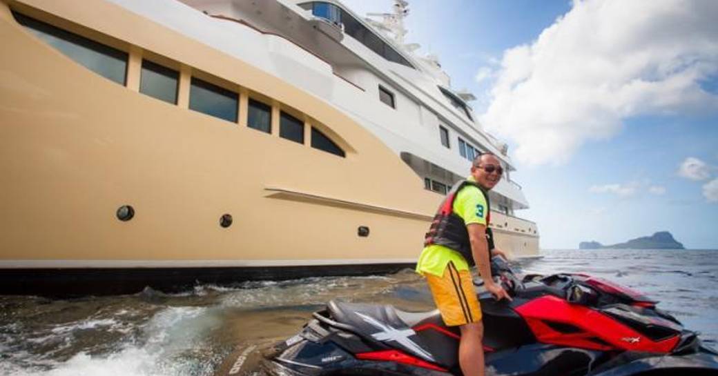 A guest enjoys a Jetski on a charter vacation