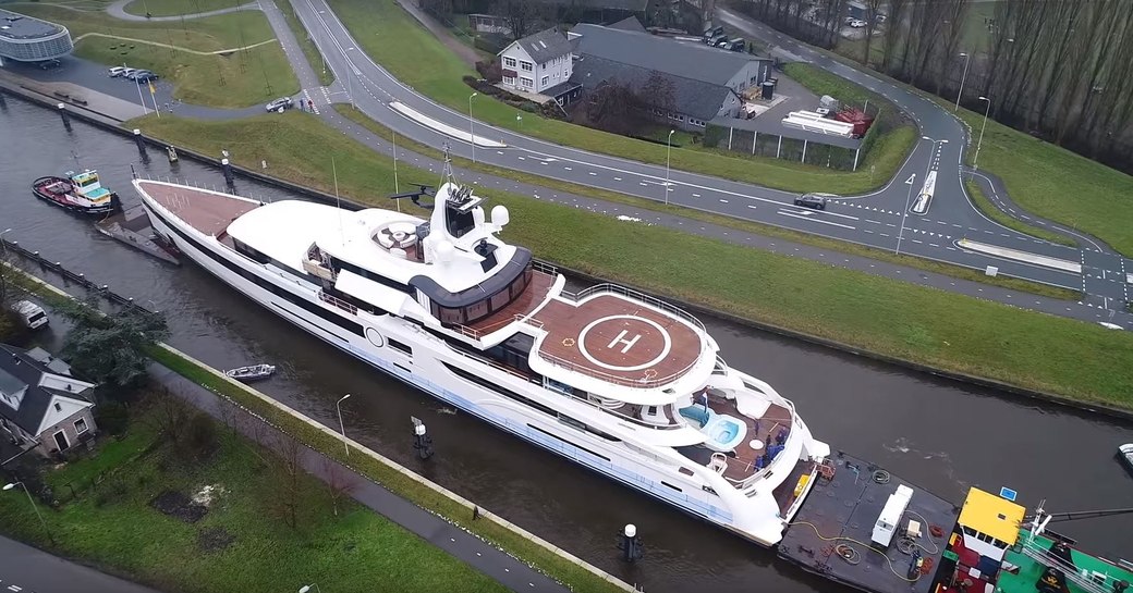 Megayacht Lady S aerial image as she passes through bridge on canal in Holland