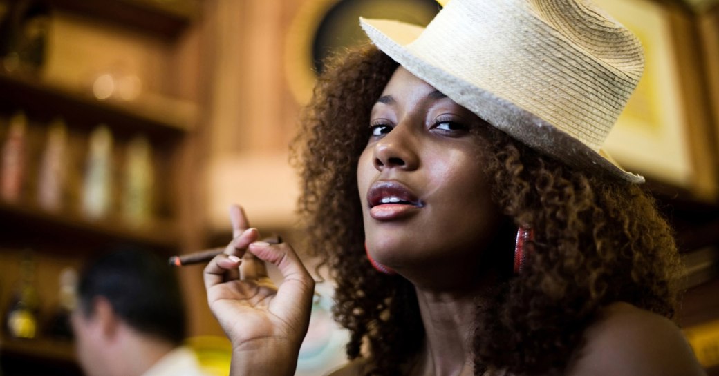 A lady smoking a cigar in Cuba