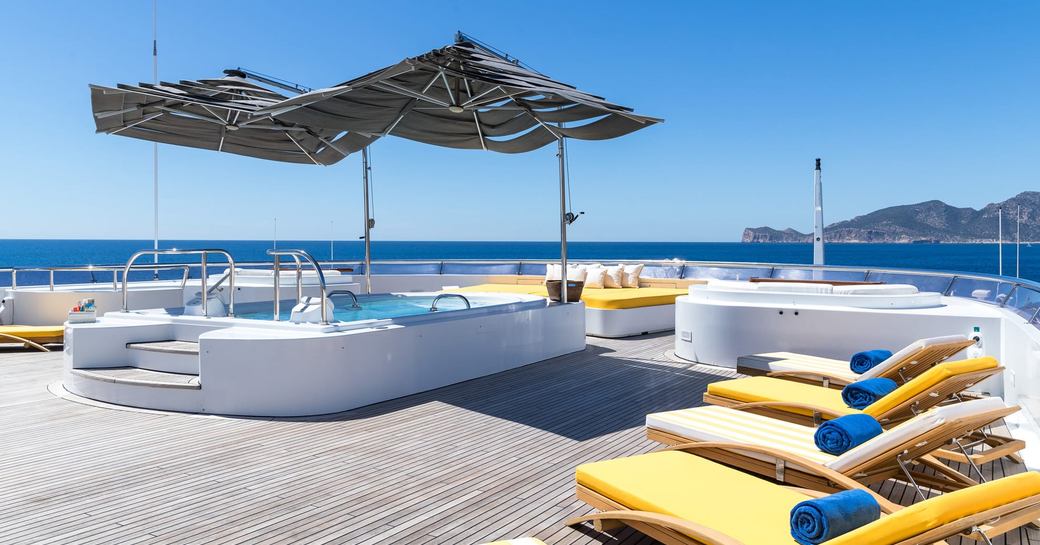 Deck Jacuzzi and sun loungers onboard charter yacht BOADICEA