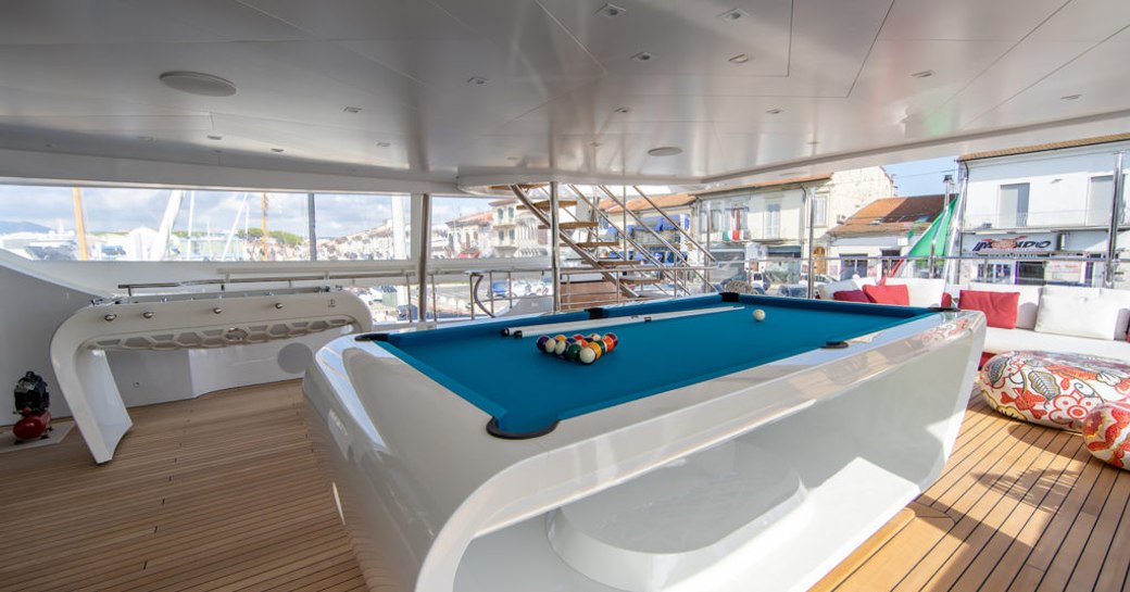 games tables on the decks of benetti luxury yacht happy me