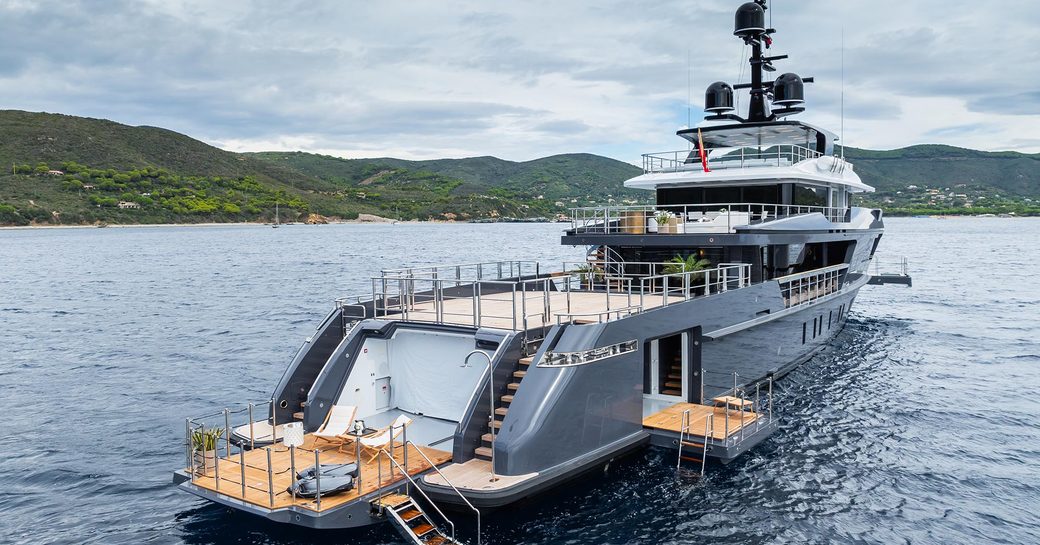 Aft view of charter yacht M with open waterside terrace