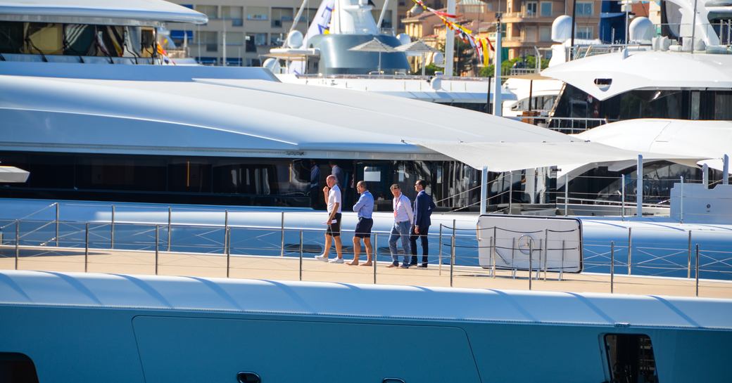 brokers chat on the decks of superyacht aviva during monaco boat show