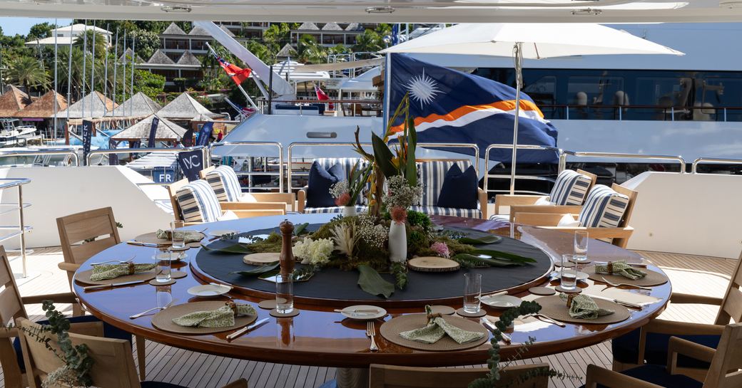 Adorned table on the exteriors of a superyacht charter