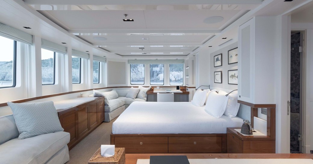 Large main cabin on explorer yacht 'Blue II' with double bed and lots of windows