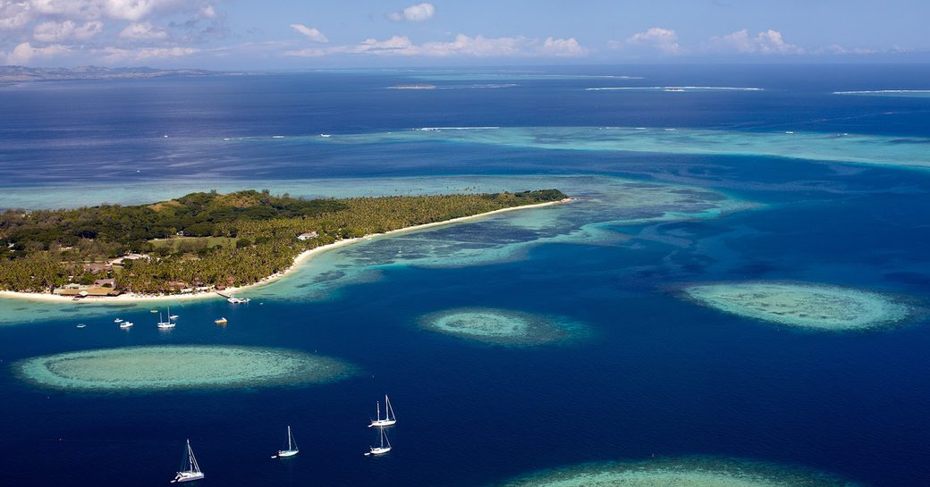 Aerial view of Cat Island with yachts nearby