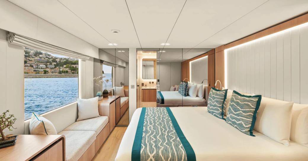 Charter yacht AMITATU master cabin with central berth and large window