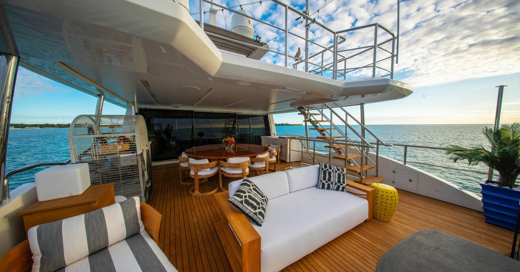 Exteriors onboard luxury yacht charter REHAB with large white sofas