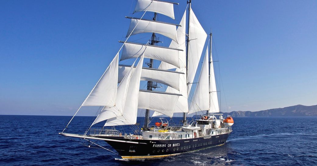 Charter yacht RUNNING ON WAVES at sea