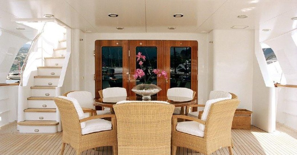 Outside dining area on the deck of luxury yacht Eleni