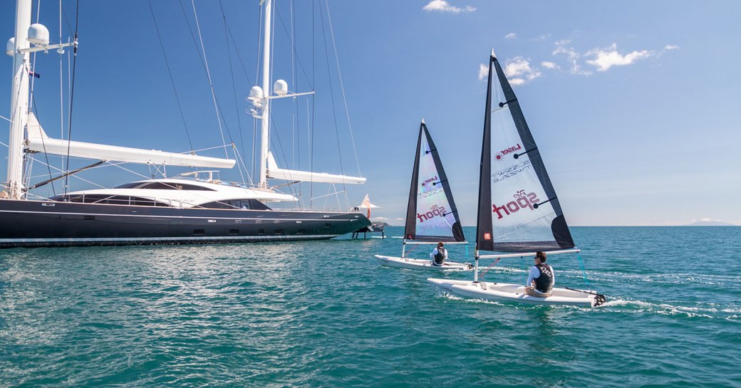 Guests enjoying sailing lasers onboard SY Twizzle