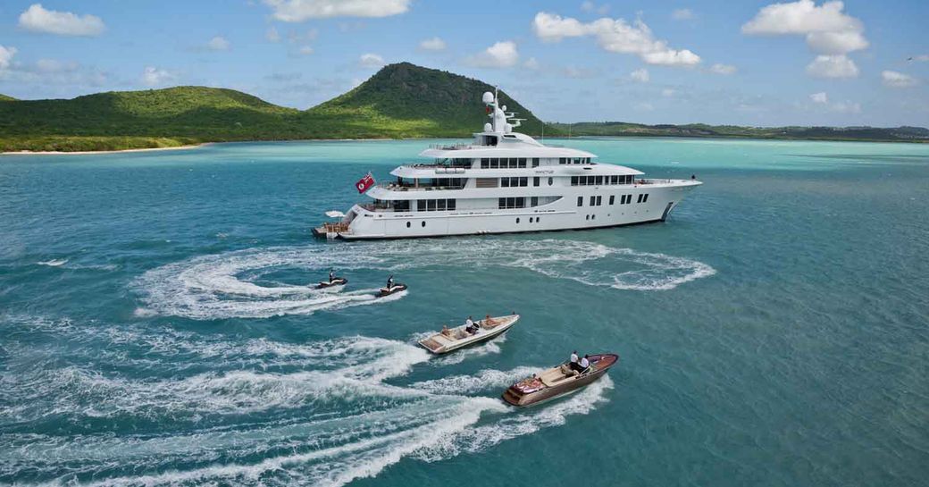 guests on a luxury yacht charter enjoying some water sports away from the crowds where they are more susceptible to COVID-19