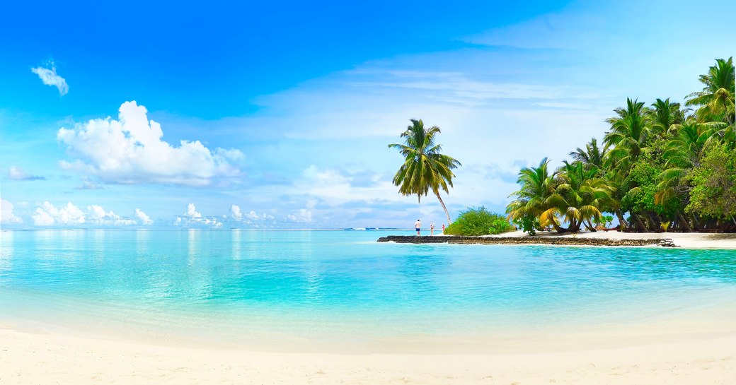 Blue water and white sandy beach in the Caribbean