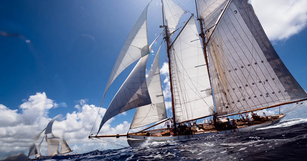 two competing yachts cut through the water at the Antigua Classic Yacht Regatta 