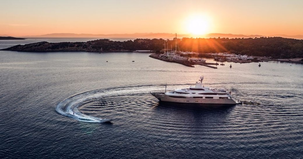 Superyacht Light Holic at anchor with an extended tender