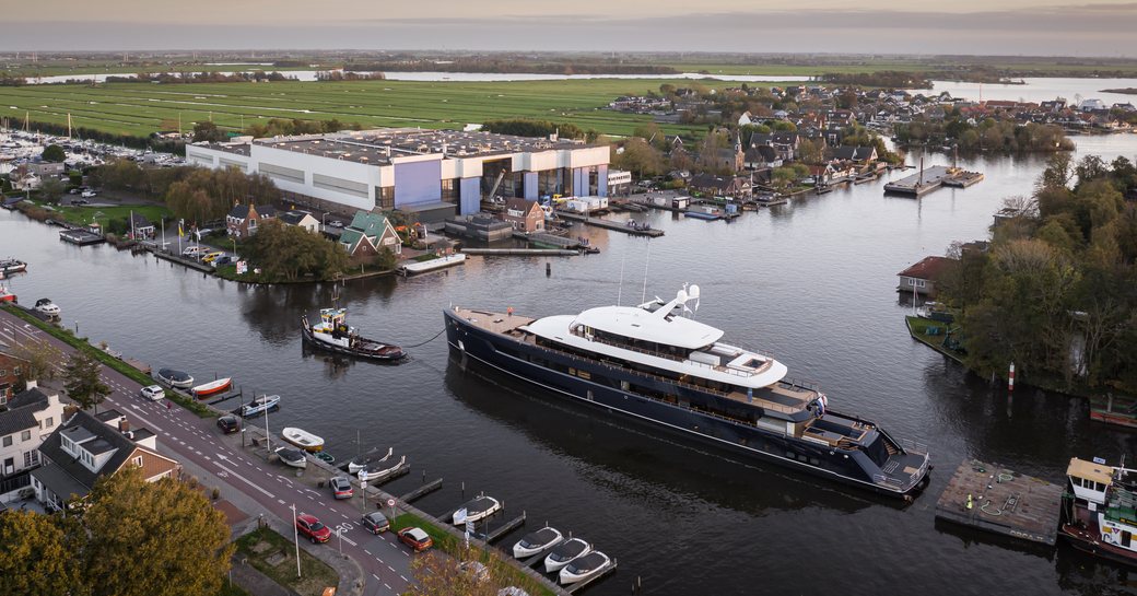 Superyacht ONE under escort on Dutch river