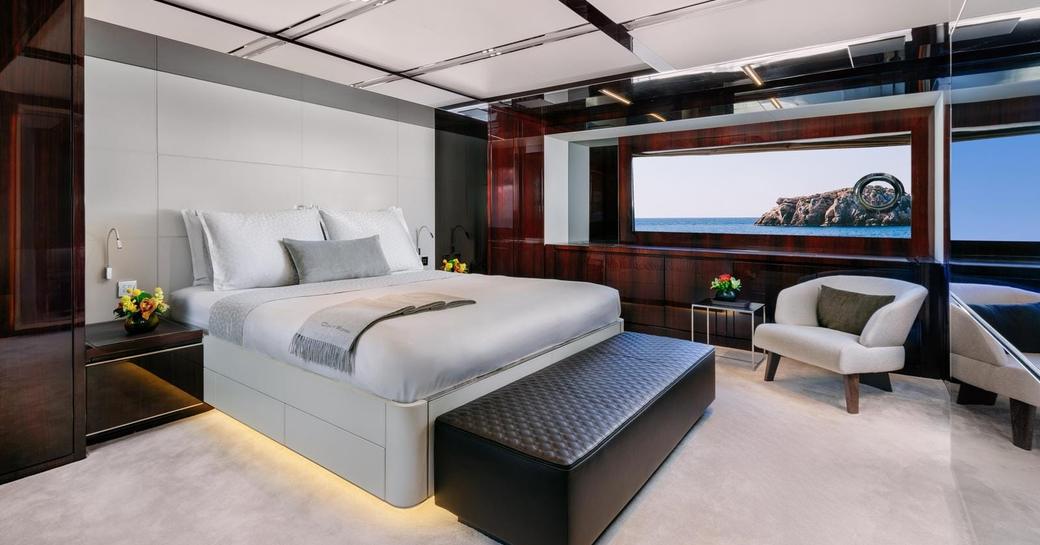 Master cabin with central berth and large window onboard luxury charter yacht DON'T WORRY