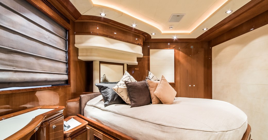 Large cabin on Superyacht Queen of Sheba with lightly colored bed