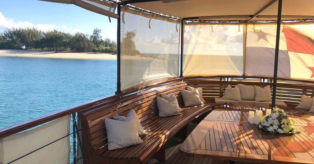 upper deck aft of luxury yacht over the rainbow