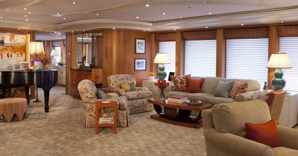 warm and welcoming main salon aboard superyacht OASIS with grand piano