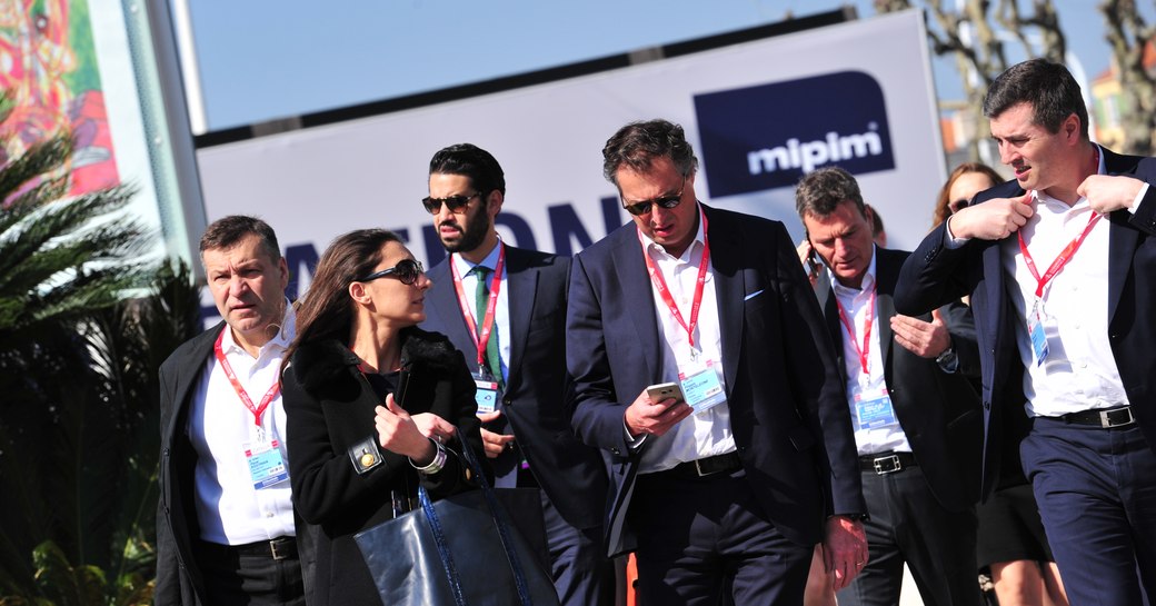 attendees at MIPIM walking outside Palais des Festivals