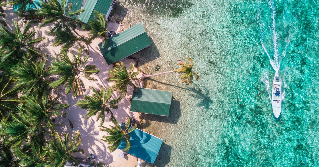 Tobacco Caye aerial in Belize barrier reef with boat