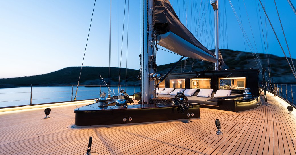 Fore deck of sailing yacht Rox Star with sun beds and cabin house