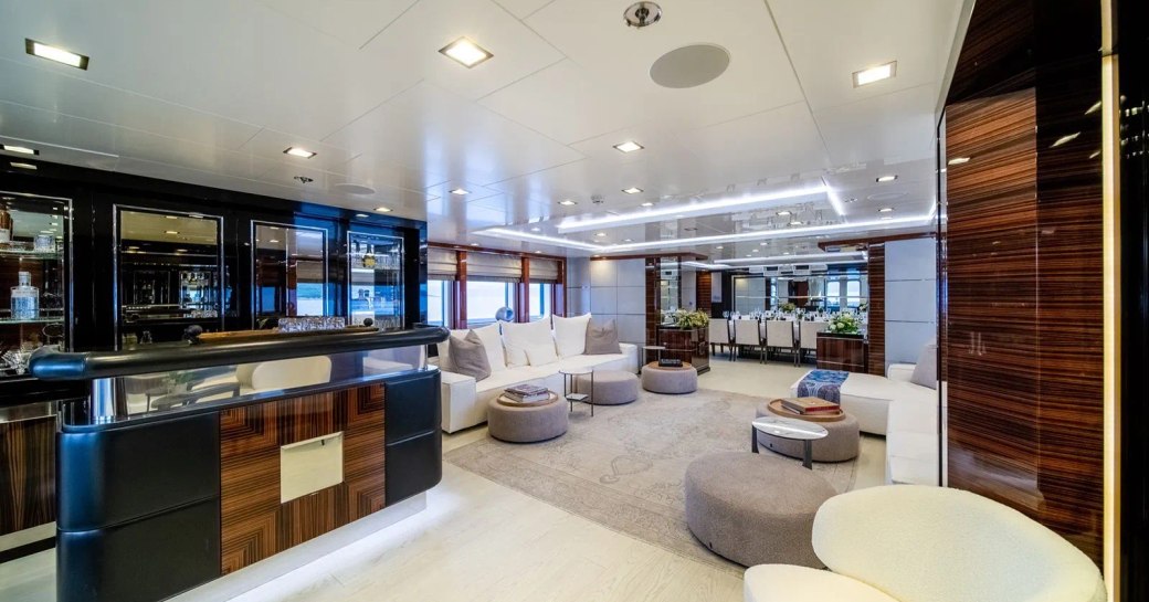 Upper salon onboard charter yacht HOLDIN' MY OWN with plush armchairs and a wet bar