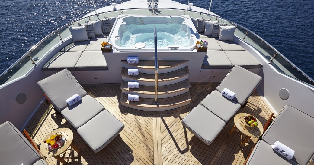 Sundeck with Jacuzzi and chaise loungers on board superyacht Zoom Zoom Zoom 