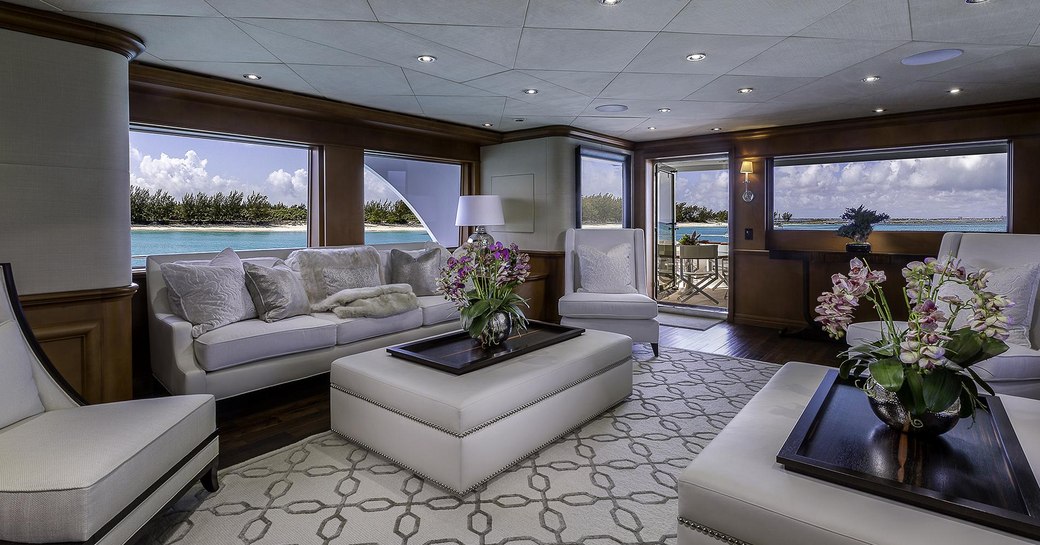 sofas and armchairs in the timeless-styled main salon aboard motor yacht M3