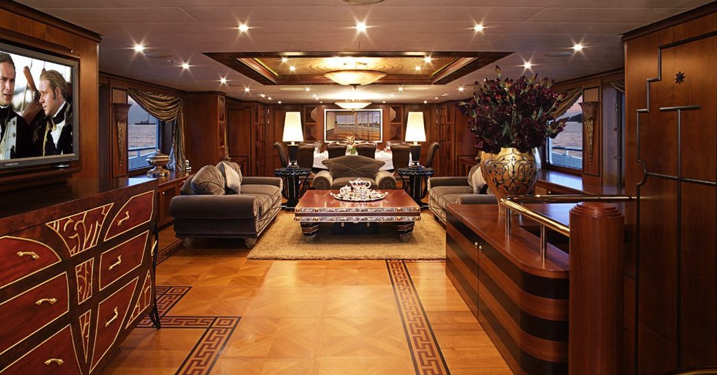 eclectic styling in the warm and welcoming main salon of superyacht DENIKI