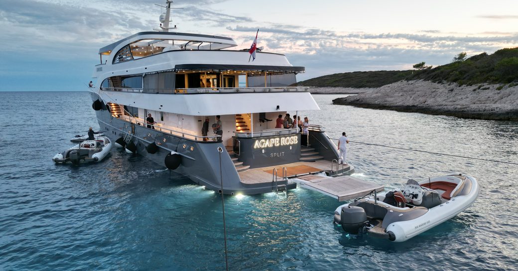 Charter yacht AGAPE ROSE at anchor with tender deployed