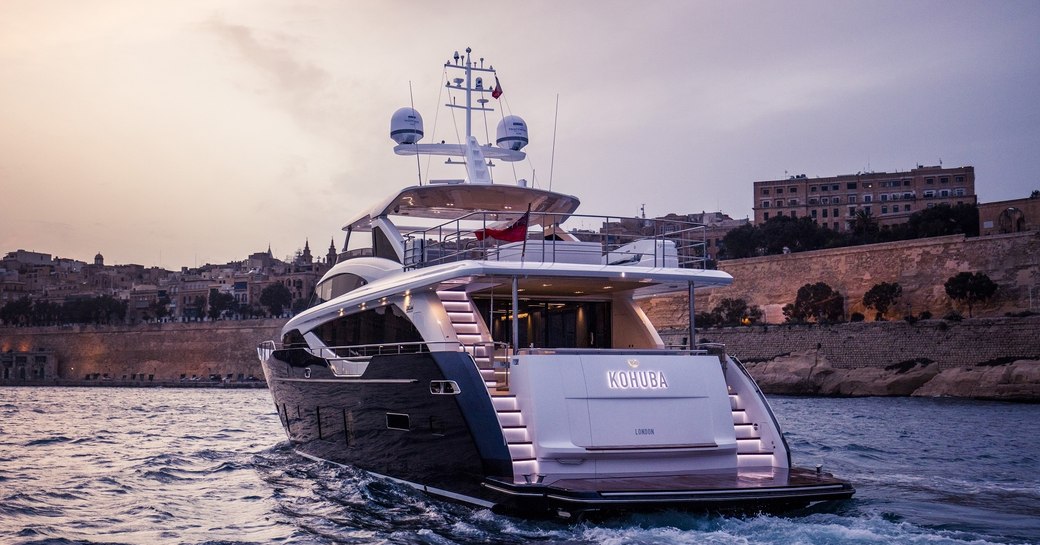 view of stern of motor yacht KOHUBA at dusk