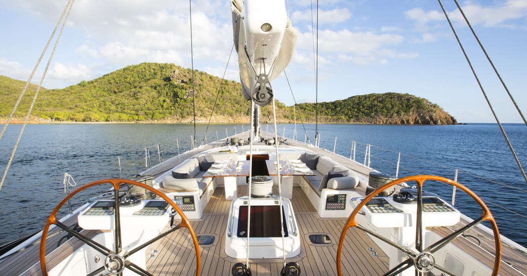 shot of alfresco dining area on aft deck of charter yacht MUZUNI taken from helm station