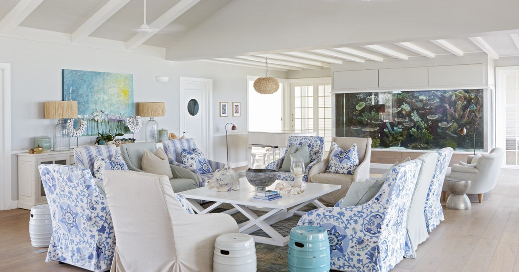 family room on thanda island, with lounge seating and aquarium